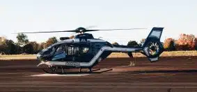 a helicopter sitting on top of an airport tarmac